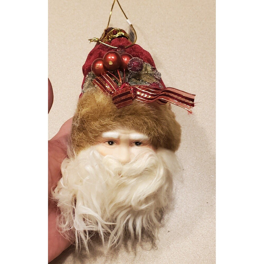 Vintage ceramic face santa ornament.